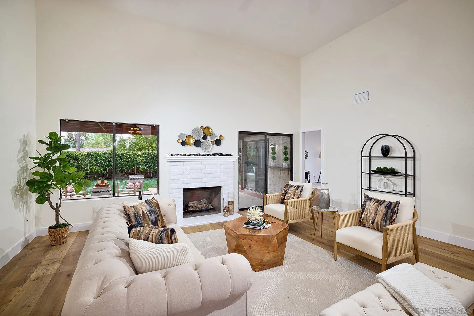 13269 Vinter Way Poway, CA 92064 - Photo 7 of 32 a living room with furniture a flat screen tv and a fireplace