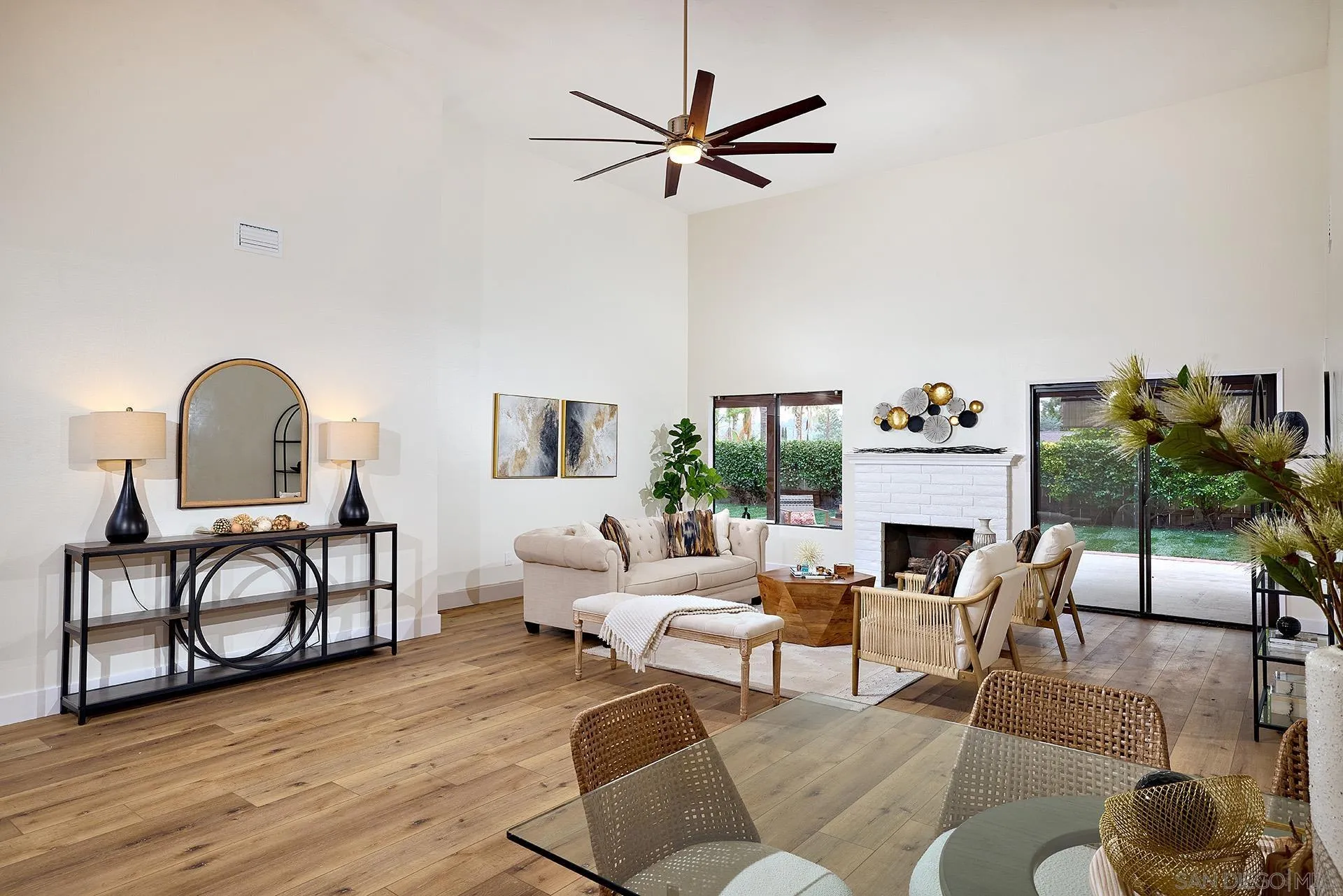 13269 Vinter Way Poway, CA 92064 - Photo 9 of 32 a living room with furniture a fireplace and a floor to ceiling window