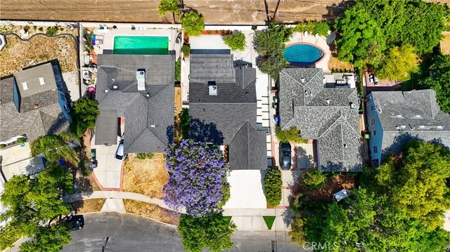 an aerial view of multiple house with outdoor space