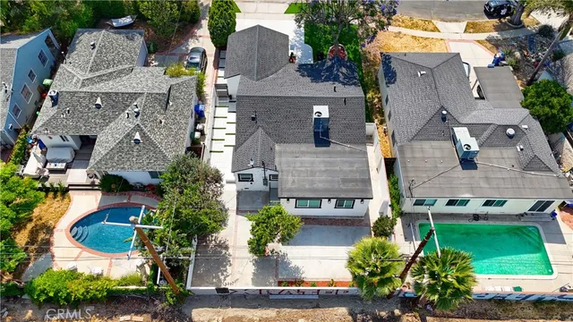 an aerial view of a house with a garden and plants