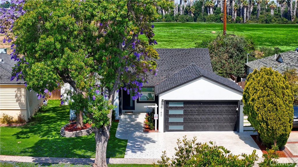6160 Shoshone Avenue Encino, CA 91316 - Photo 3 of 22 a front view of a house with garden