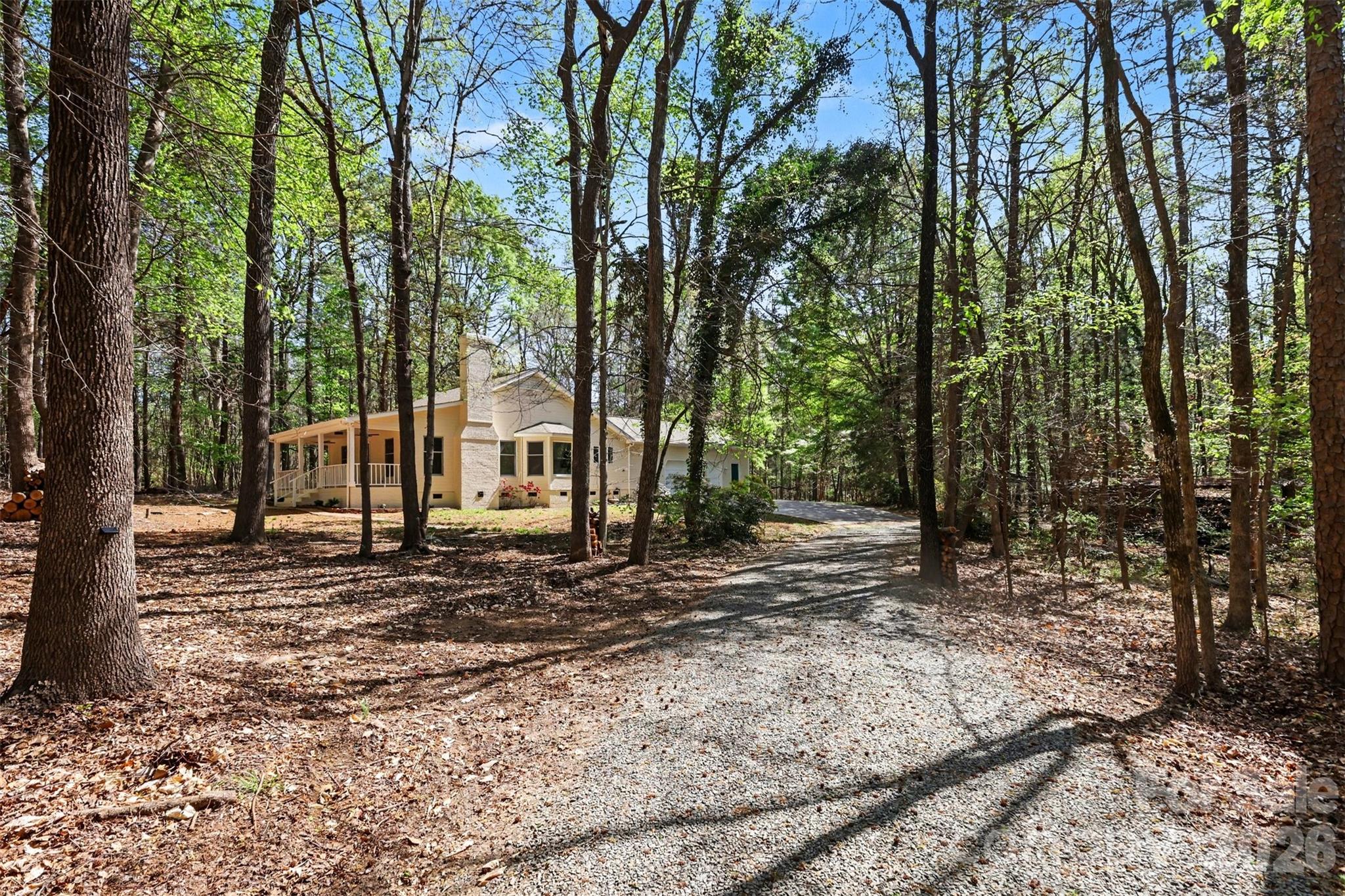 a view of a house with a yard tree s