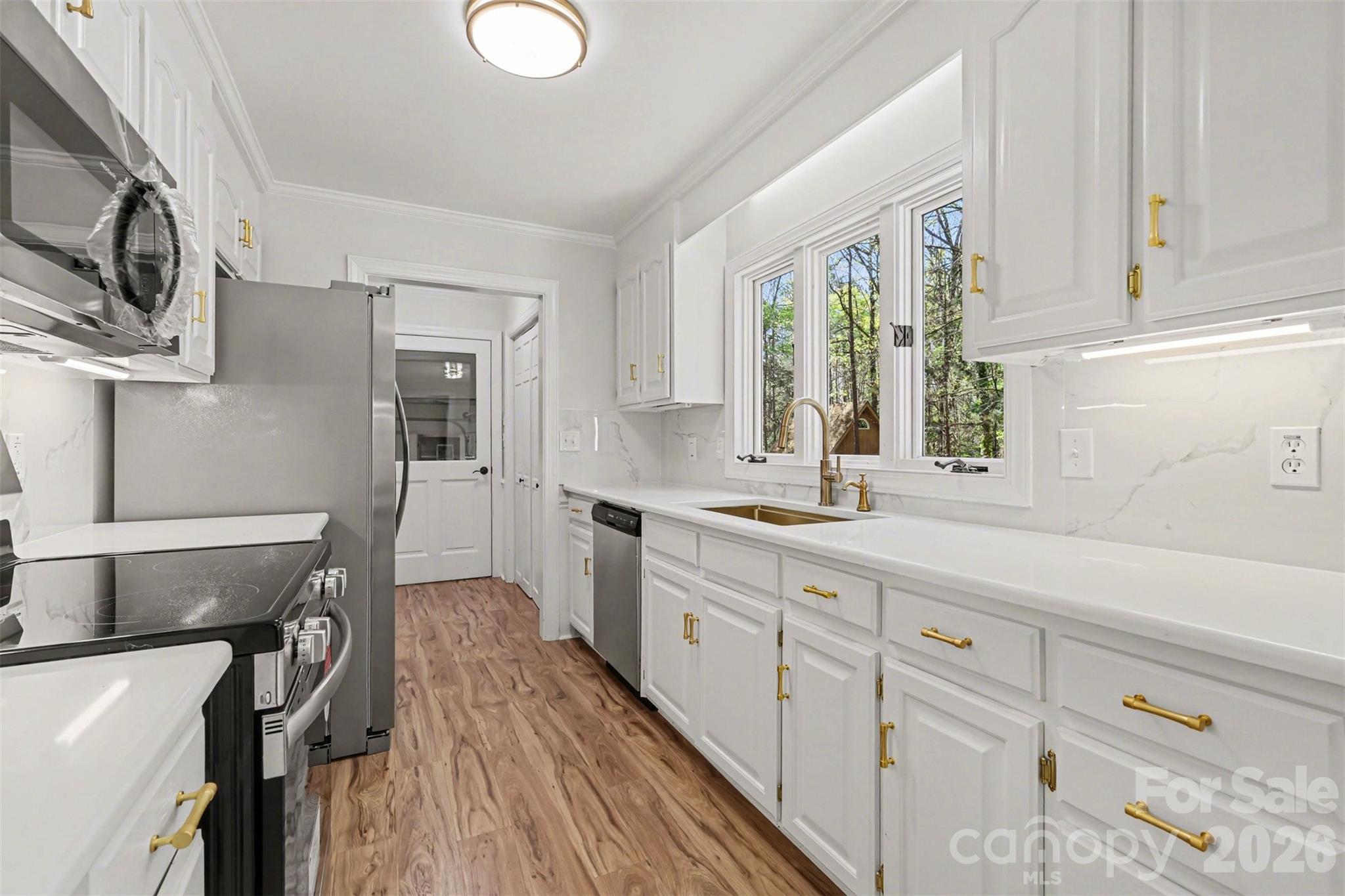 10542 Blair Road Mint Hill, NC 28227 - Photo 11 of 31 a kitchen with cabinets a sink and appliances