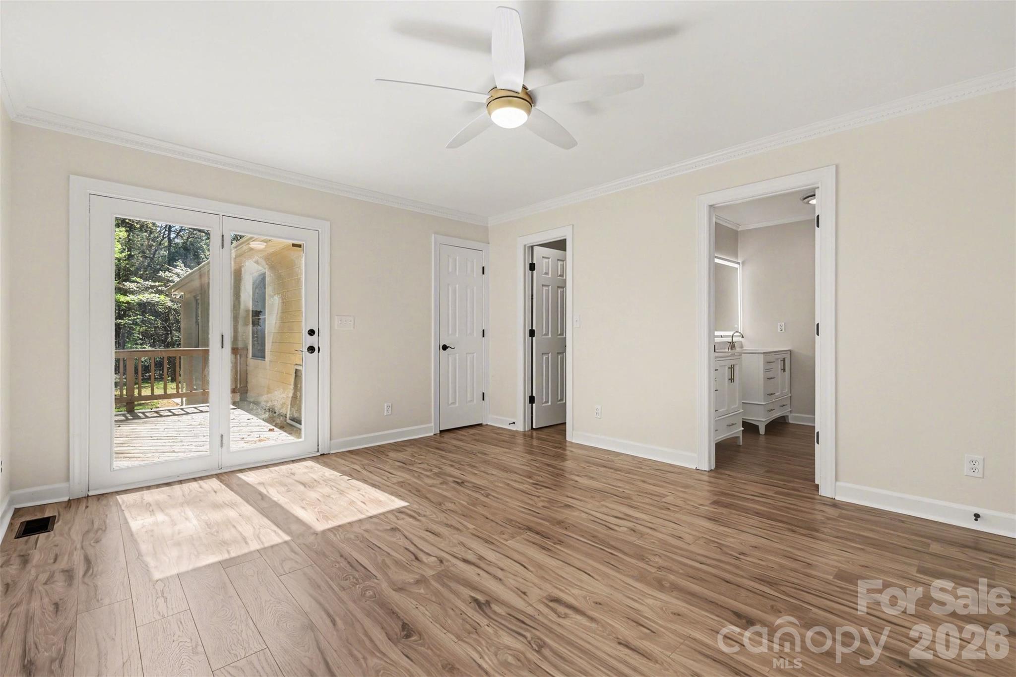 10542 Blair Road Mint Hill, NC 28227 - Photo 16 of 31 an empty room with wooden floor and a ceiling fan
