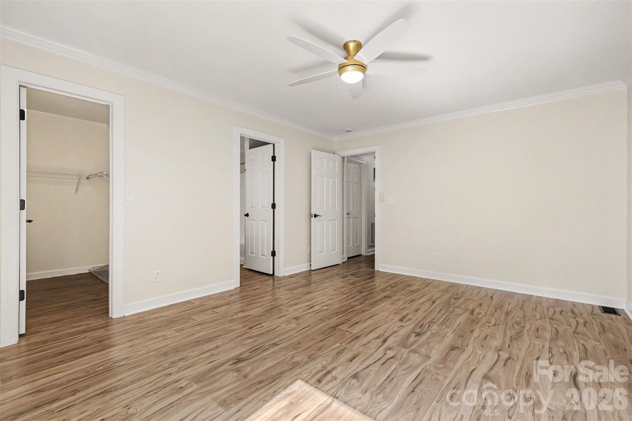 10542 Blair Road Mint Hill, NC 28227 - Photo 18 of 31 an empty room with wooden floor and a ceiling fan