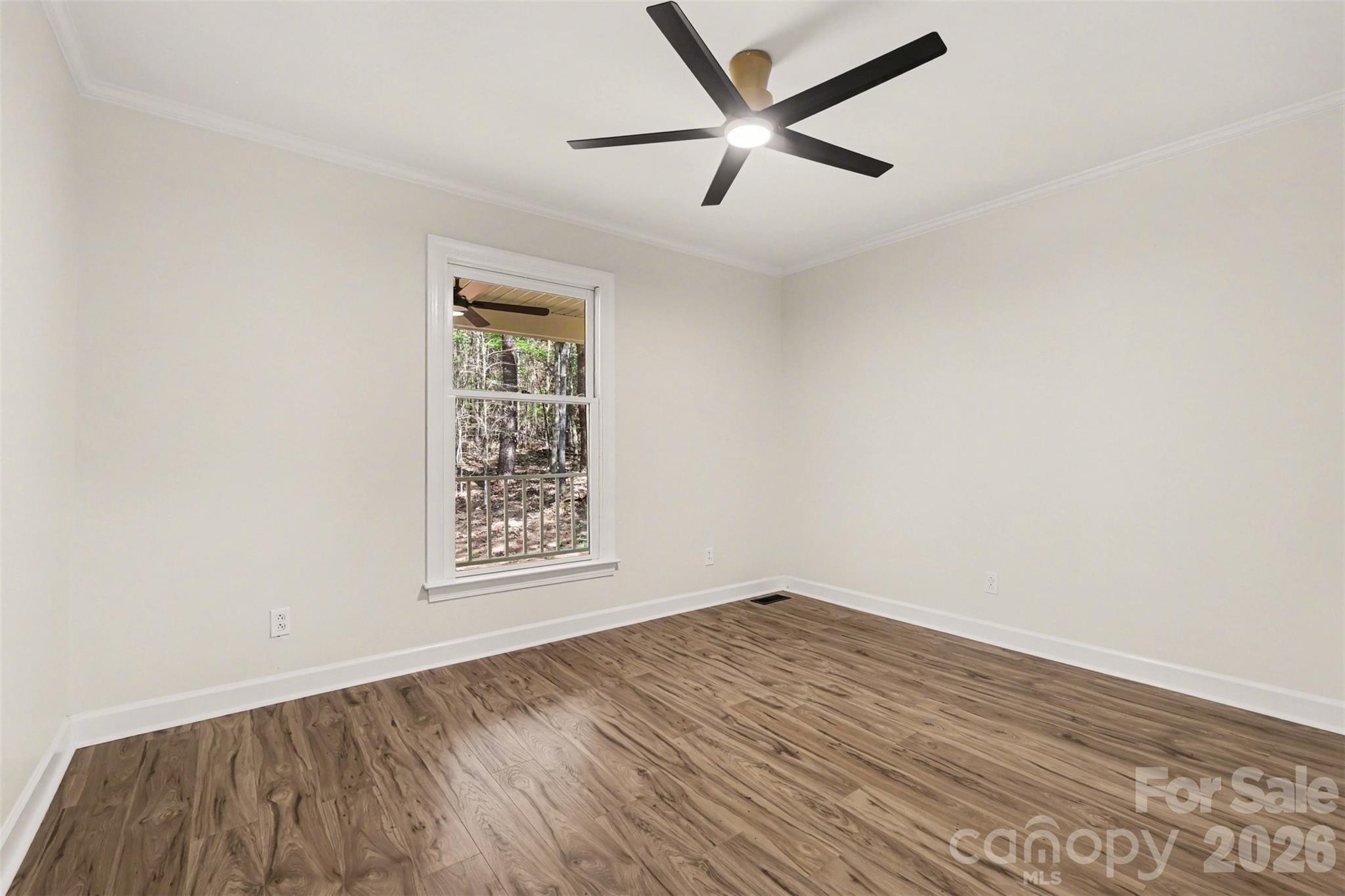 10542 Blair Road Mint Hill, NC 28227 - Photo 19 of 31 an empty room with wooden floor and windows