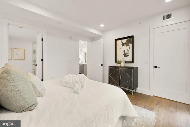 a bedroom with a bed and a view of bathroom