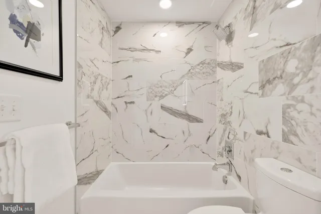 a bathroom with a bathtub and a shower curtain