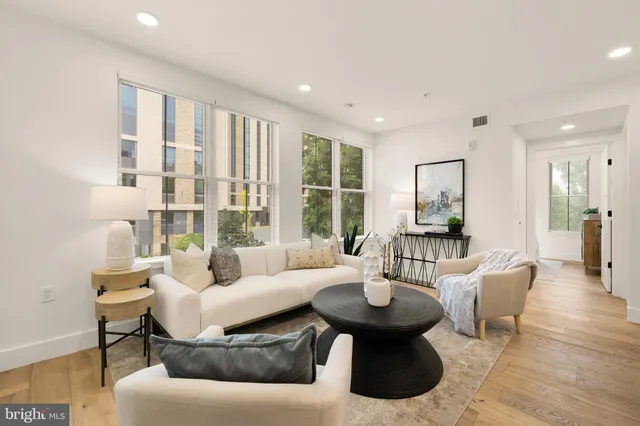 a living room with furniture and a large window