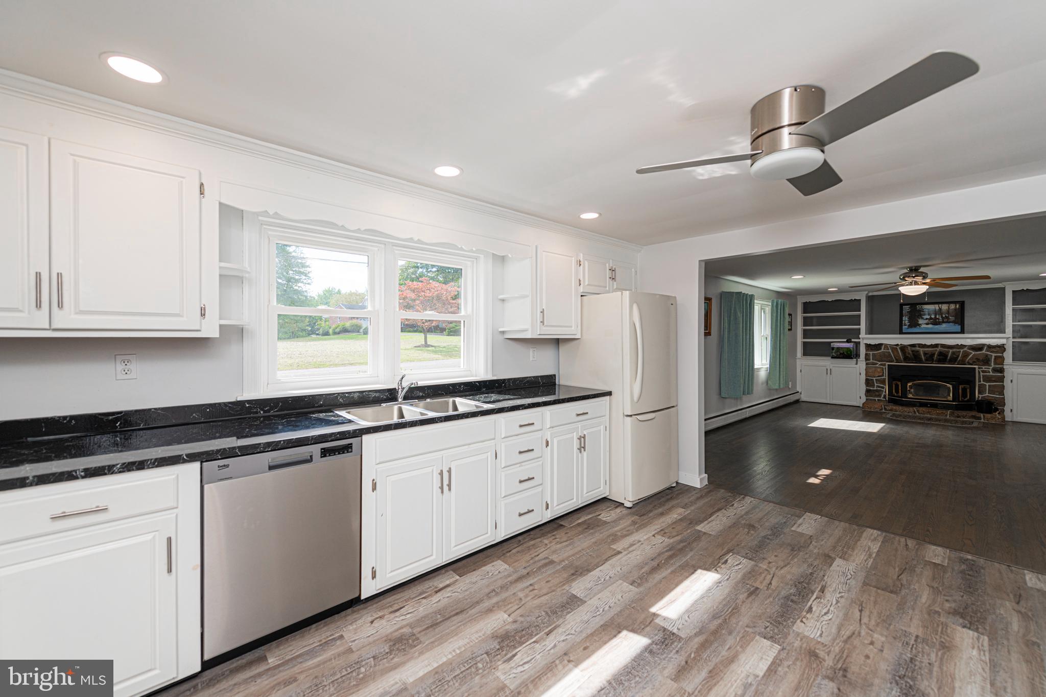 51 Keen Road Spring City, PA 19475 - Photo 14 of 32 a kitchen with granite countertop a sink cabinets and stainless steel appliances