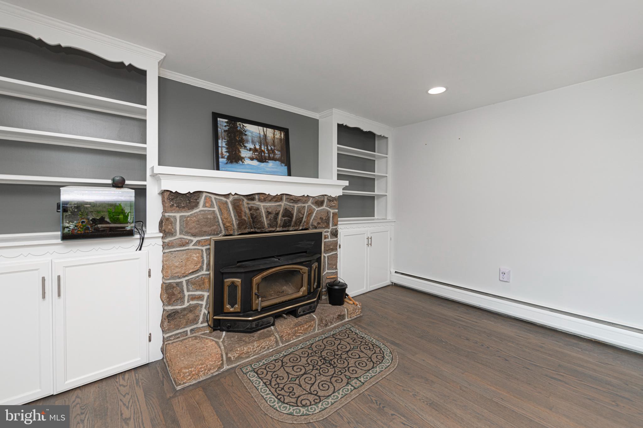 51 Keen Road Spring City, PA 19475 - Photo 18 of 32 a living room with a fireplace and a rug