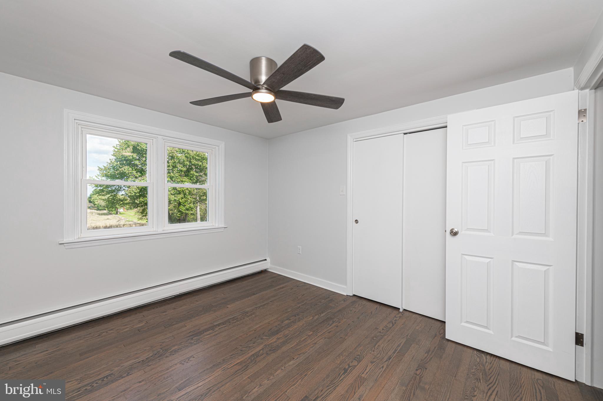 51 Keen Road Spring City, PA 19475 - Photo 21 of 32 an empty room with wooden floor closet and windows