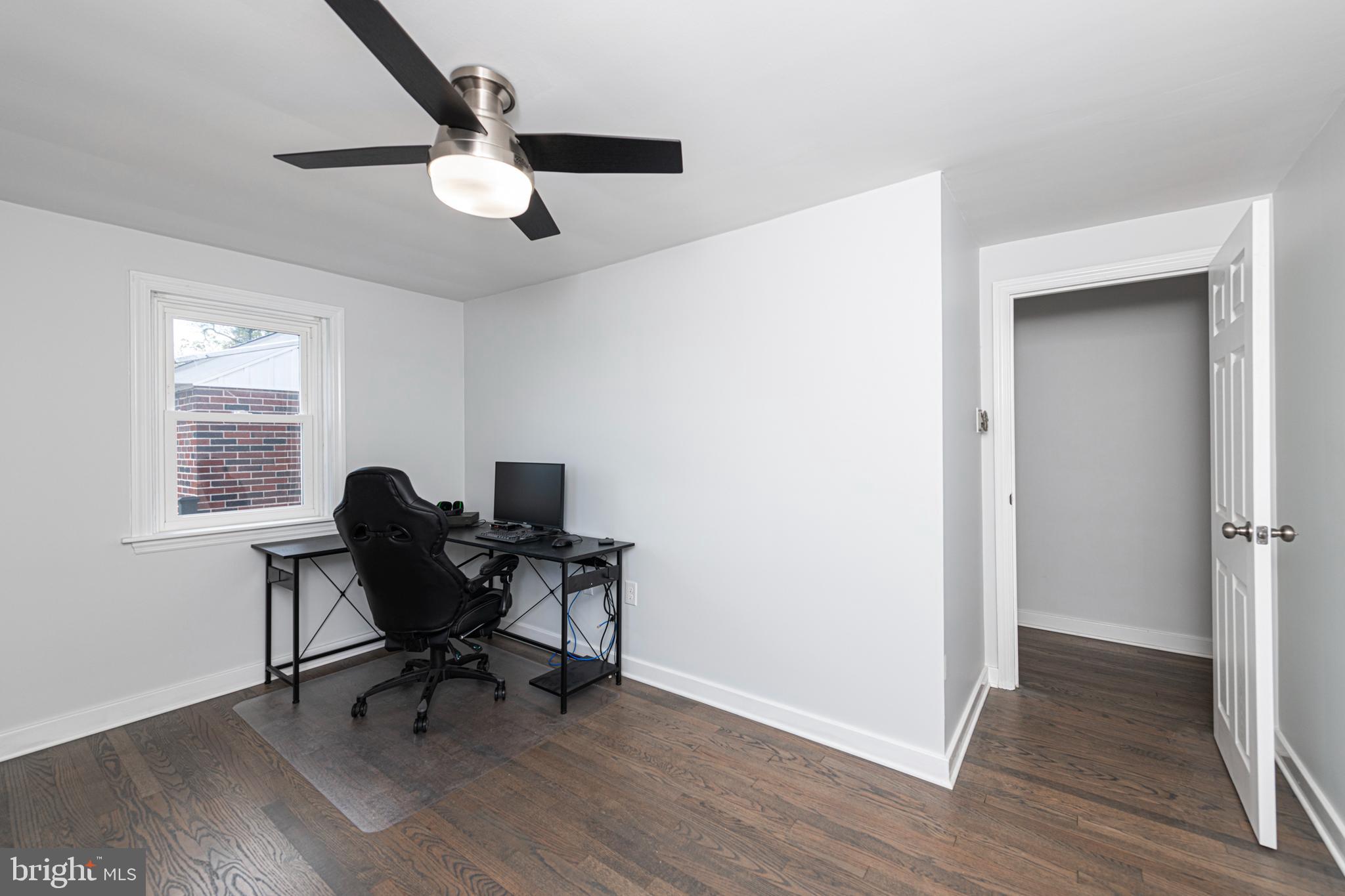 51 Keen Road Spring City, PA 19475 - Photo 22 of 32 a work room with wooden floor a ceiling fan and a window