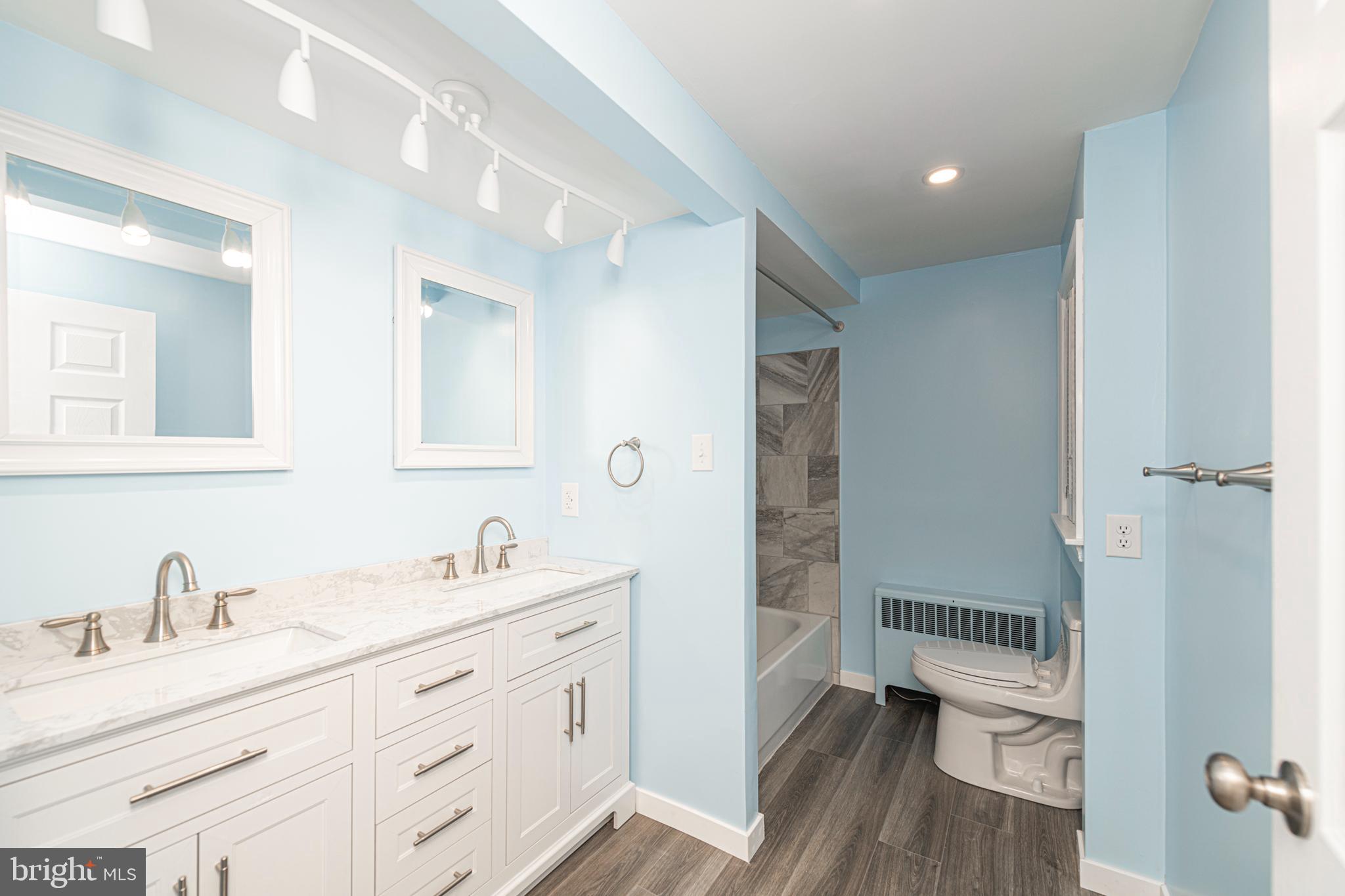 51 Keen Road Spring City, PA 19475 - Photo 24 of 32 a bathroom with a granite countertop sink toilet a large mirror a vanity and shower