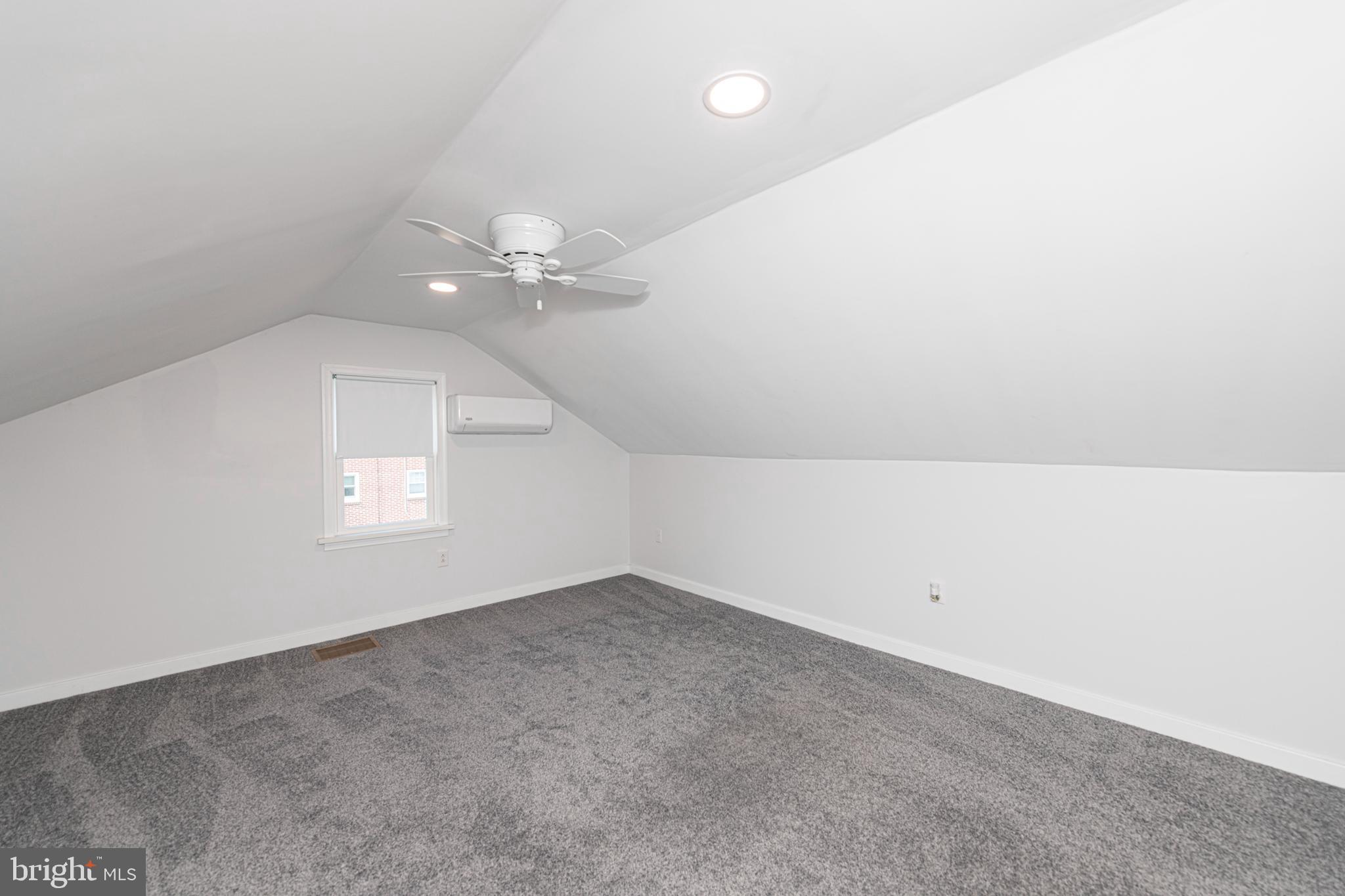 51 Keen Road Spring City, PA 19475 - Photo 27 of 32 an empty room with a chandelier fan and windows