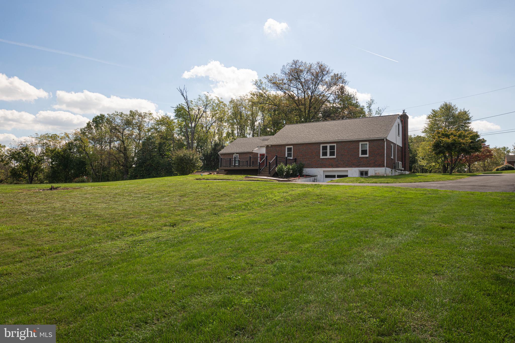 51 Keen Road Spring City, PA 19475 - Photo 4 of 32 a view of a house with a big yard and large trees