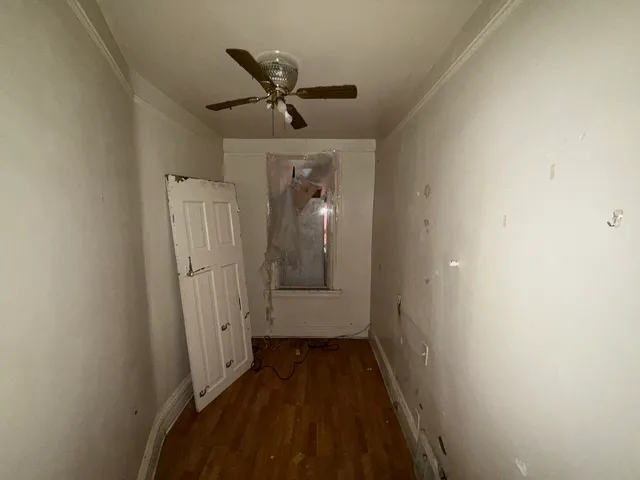 a view of a hallway with a white walls