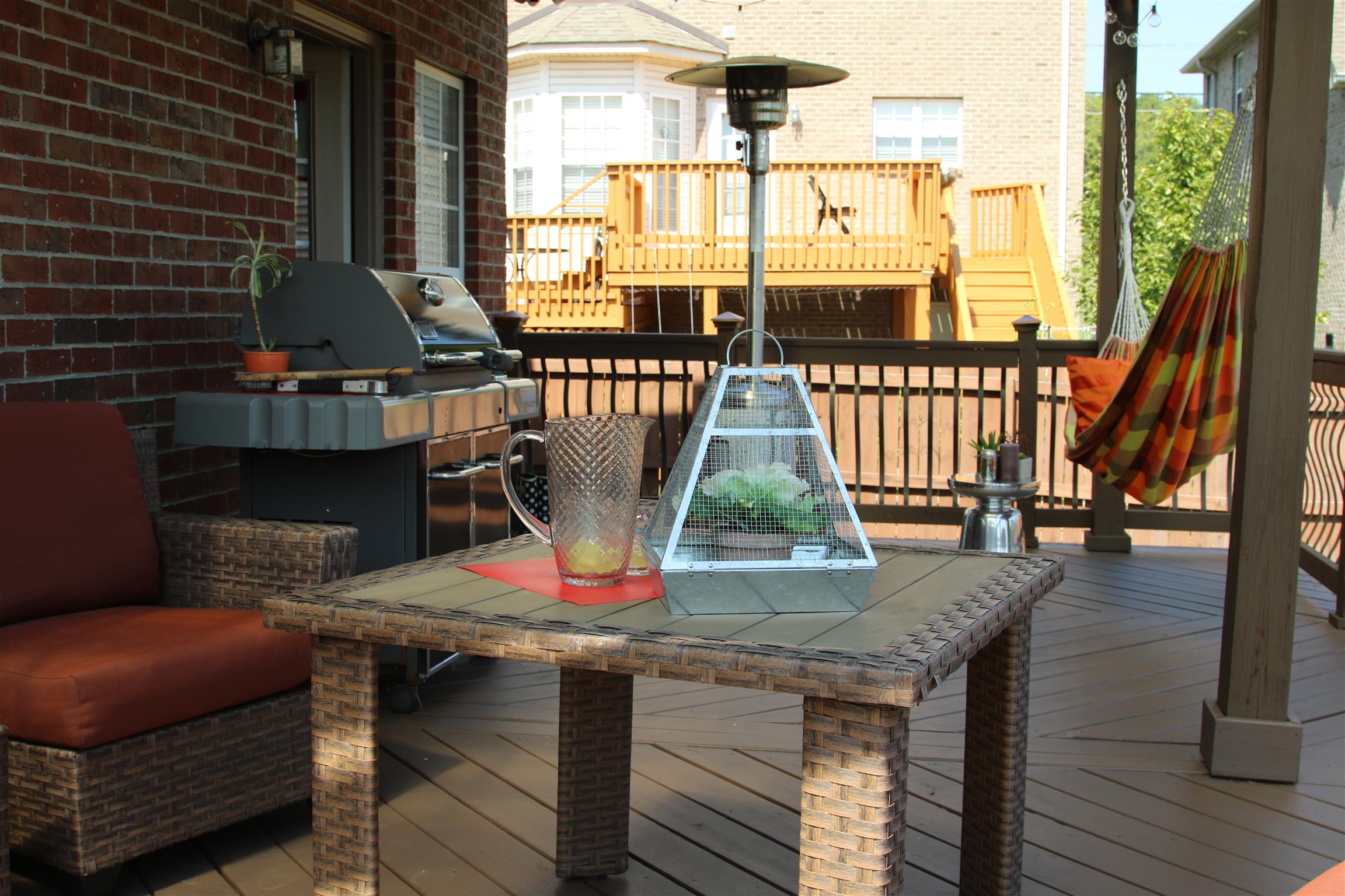 7064 Red Apple Road Antioch, TN 37013 - Photo 22 of 26 a view of a balcony with chairs and wooden floor