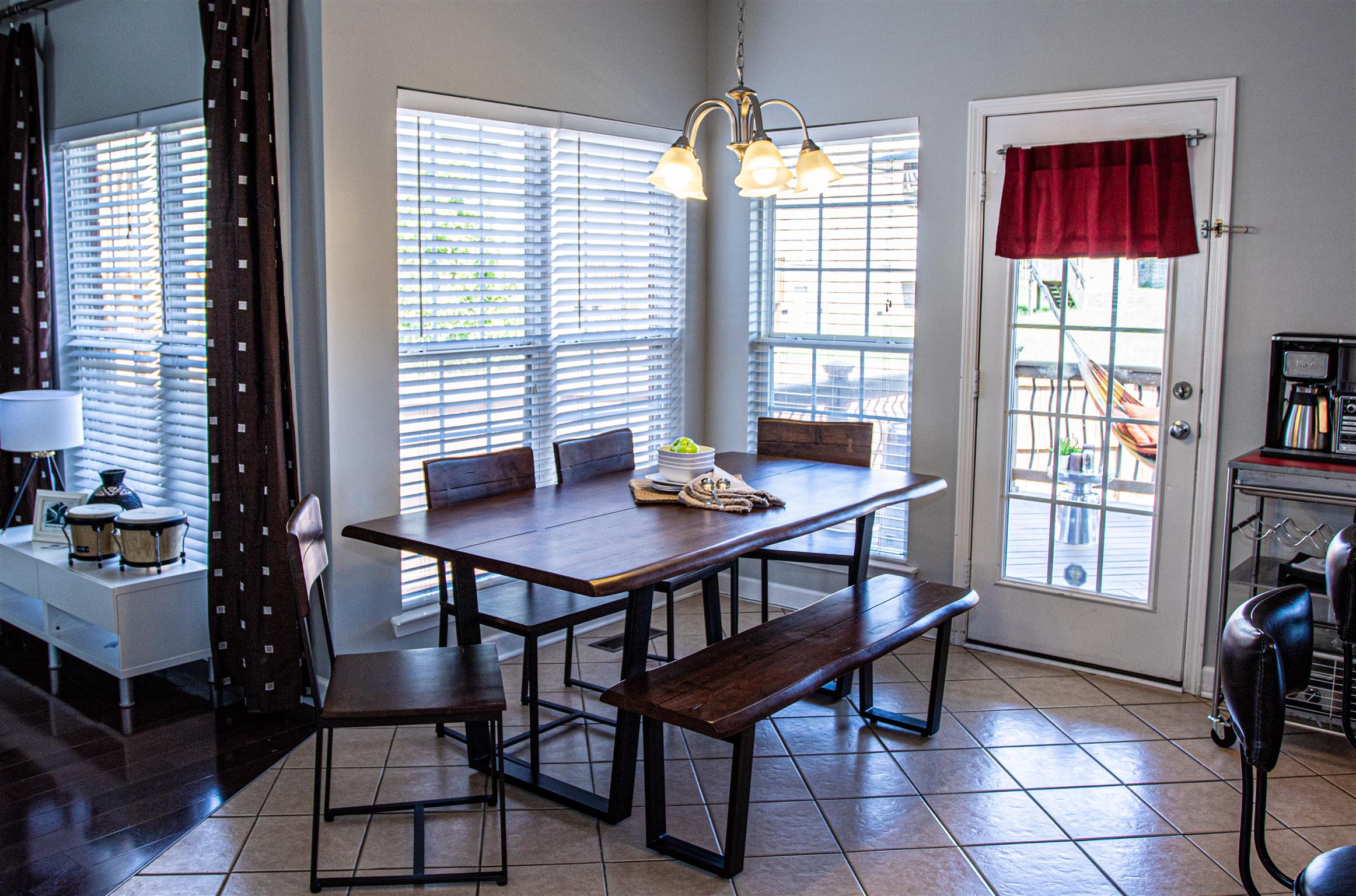 7064 Red Apple Road Antioch, TN 37013 - Photo 9 of 26 a view of a dining room with furniture and a window