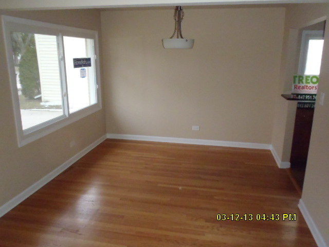 1674 Maple Street Des Plaines, IL 60018 - Photo 3 of 11 a view of wooden floor and windows in a room