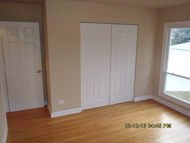 1674 Maple Street Des Plaines, IL 60018 - Photo 7 of 11 a view of an empty room with a window
