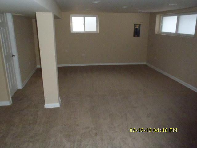 1674 Maple Street Des Plaines, IL 60018 - Photo 9 of 11 an empty room with windows