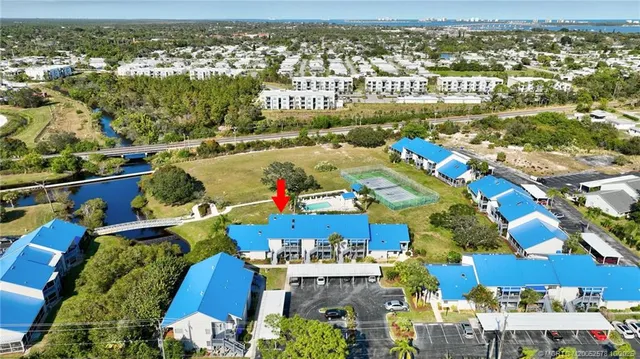 an aerial view of residential houses with outdoor space