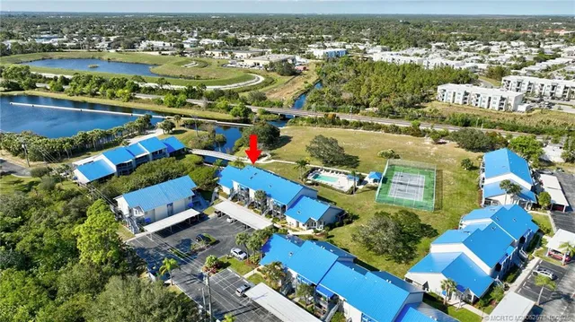 an aerial view of residential houses with outdoor space