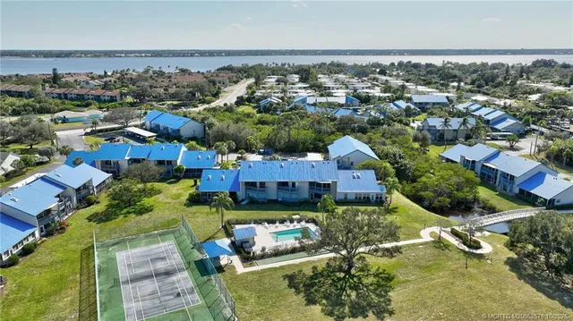 an aerial view of residential houses with outdoor space