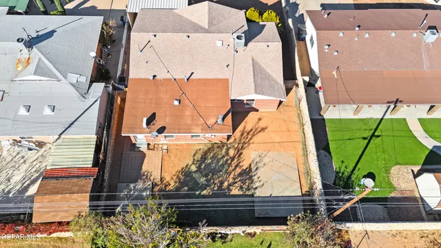 an aerial view of houses with outdoor space