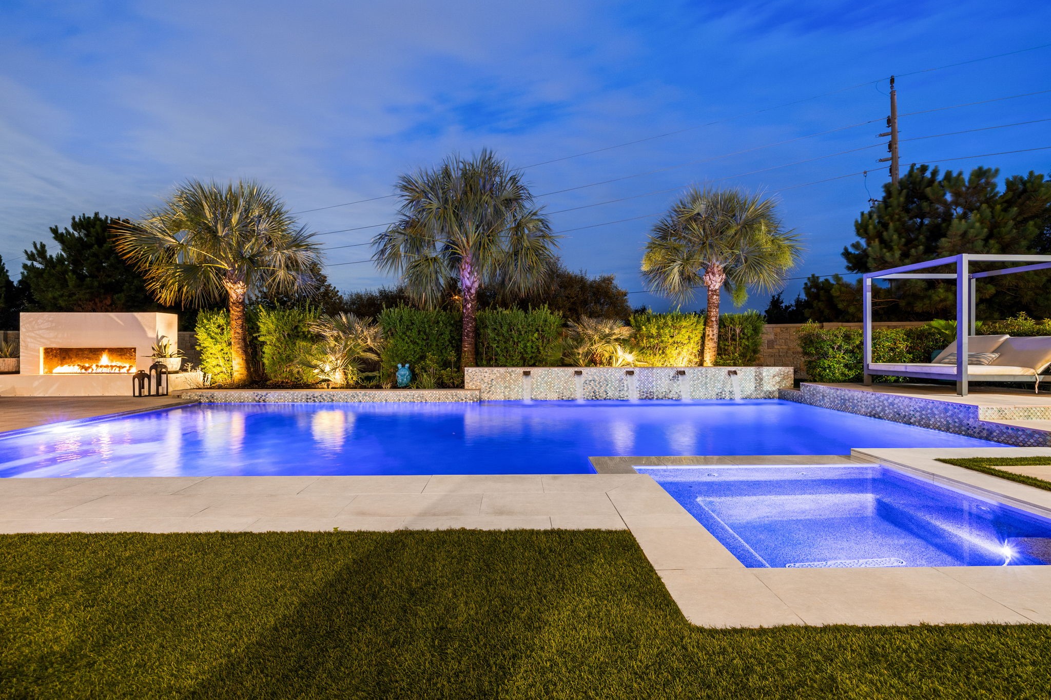 27903 Indigo Ridge Drive Fulshear, TX 77441 - Photo 43 of 50 Spectacular outdoor retreat featuring a resort-style pool and spa, expansive patio spaces, and seamless indoor-outdoor living.