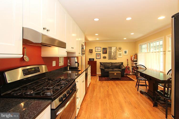 11327 Myrtle Lane Reston, VA 20191 - Photo 3 of 30 a large kitchen with stainless steel appliances a large counter top