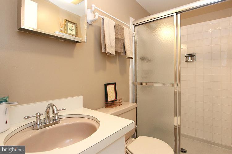 11327 Myrtle Lane Reston, VA 20191 - Photo 5 of 30 a bathroom with a sink toilet and shower