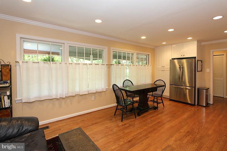 11327 Myrtle Lane Reston, VA 20191 - Photo 7 of 30 a view of a dining room with furniture and wooden floor