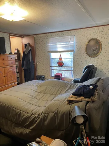 a bedroom with a bed and cabinets