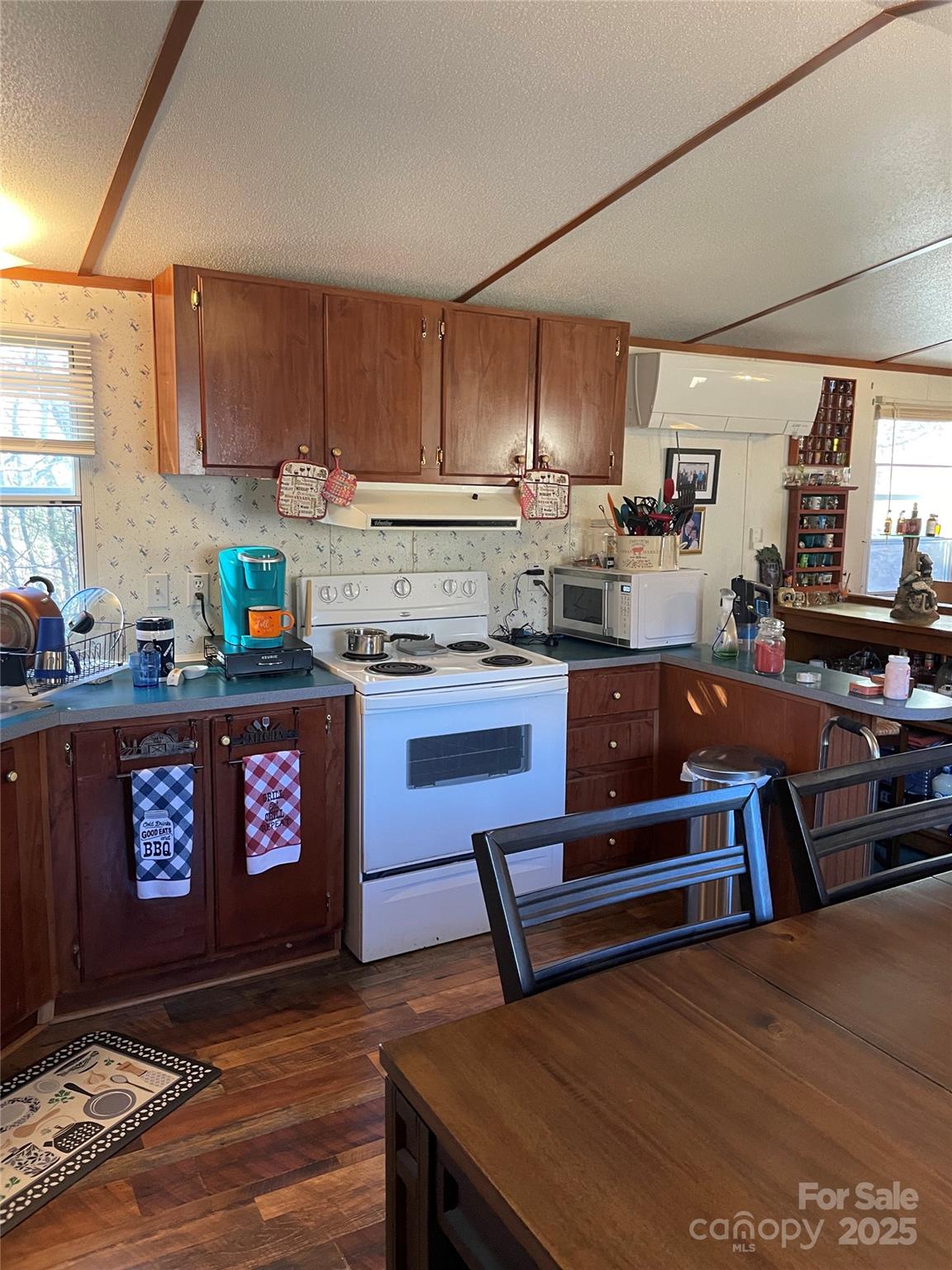 3265 Revere Road Marshall, NC 28753 - Photo 9 of 23 a kitchen with a refrigerator and a stove top oven