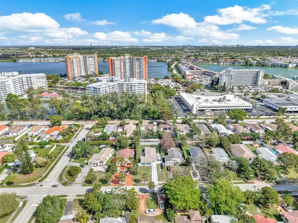 a bathroom with a toilet a sink and shower
