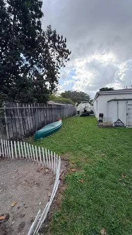 a view of a backyard with sitting area