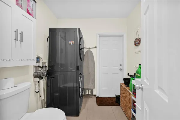 a kitchen with stainless steel appliances a refrigerator and a stove top oven
