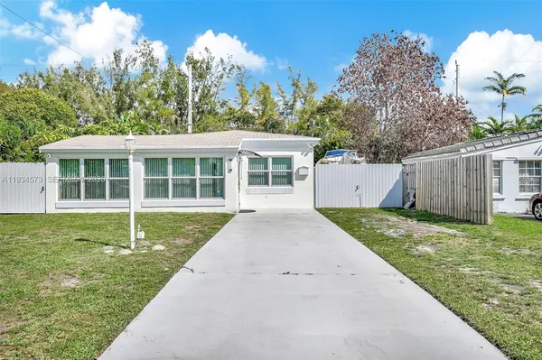 a house with trees in the background