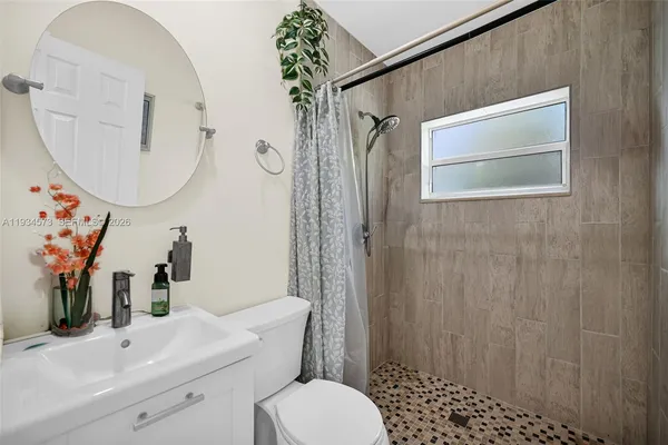 a kitchen with stainless steel appliances granite countertop a refrigerator and a stove