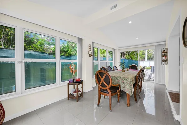 a bedroom with a bed and a wall painting