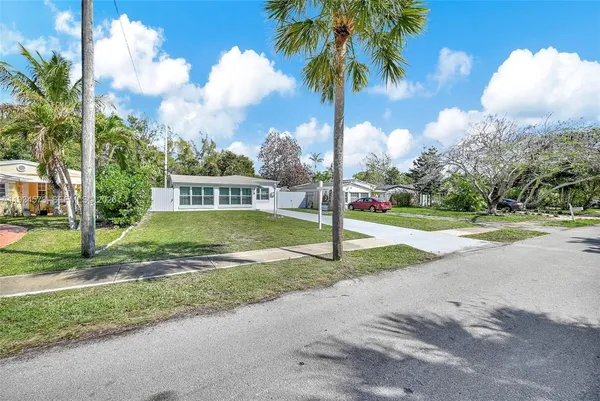 an aerial view of multiple houses with yard