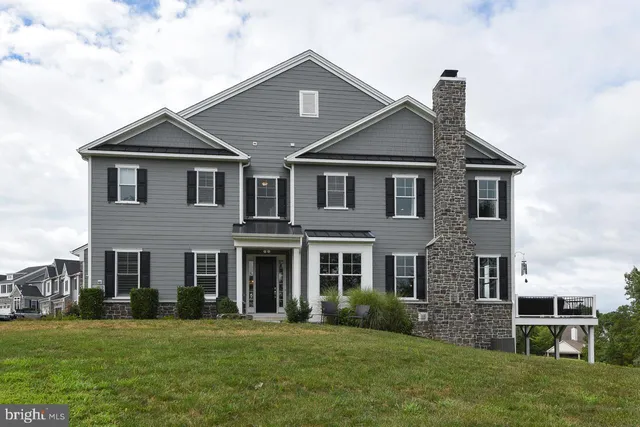 front view of brick house with a yard