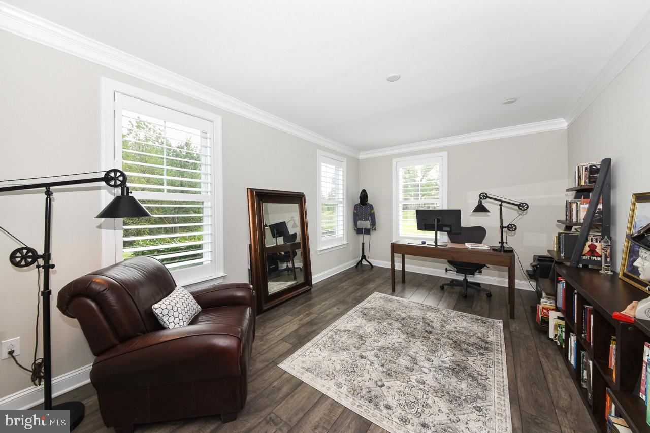 8 Elizabeth Lane Doylestown, PA 18901 - Photo 23 of 50 a living room with furniture and a fireplace
