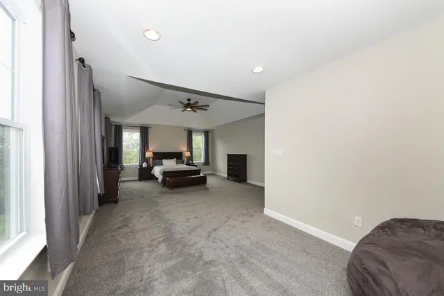 a view of a livingroom with furniture and a window