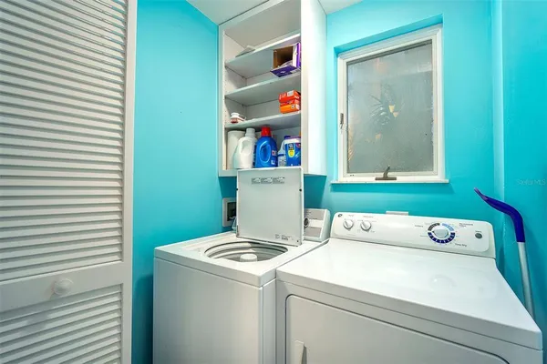 a utility room with dryer and washer