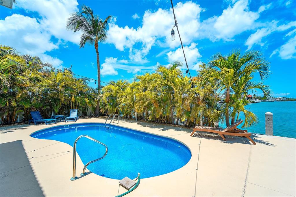 770 9th Street Key Colony Beach, FL 33051 - Photo 29 of 39 a view of swimming pool with a yard