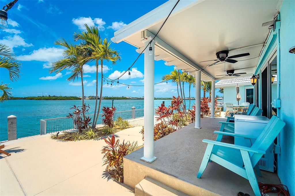 770 9th Street Key Colony Beach, FL 33051 - Photo 31 of 39 a view of a patio with a table and chairs