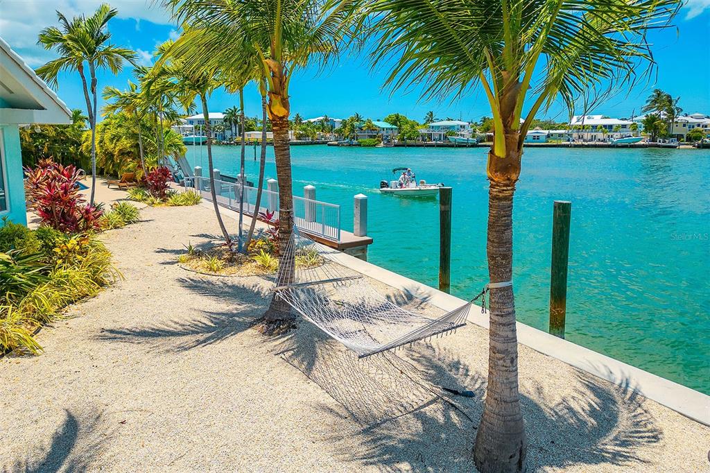 770 9th Street Key Colony Beach, FL 33051 - Photo 32 of 39 a view of a lake with a palm tree